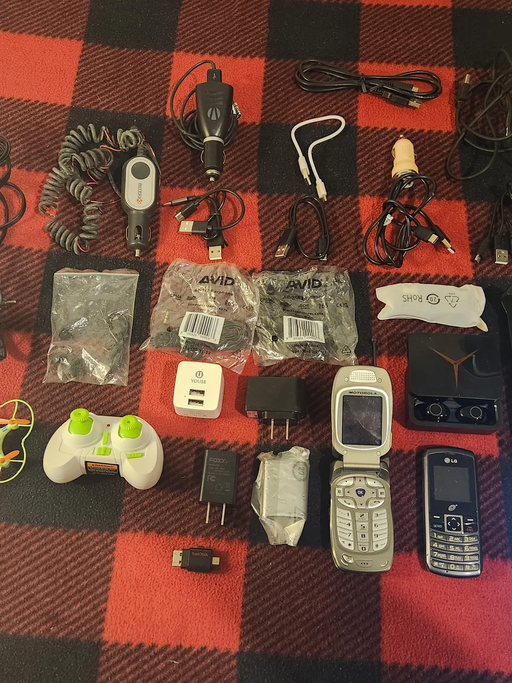 Elctronics Lot, Cellphones, Charging Cords, Remotes, And More